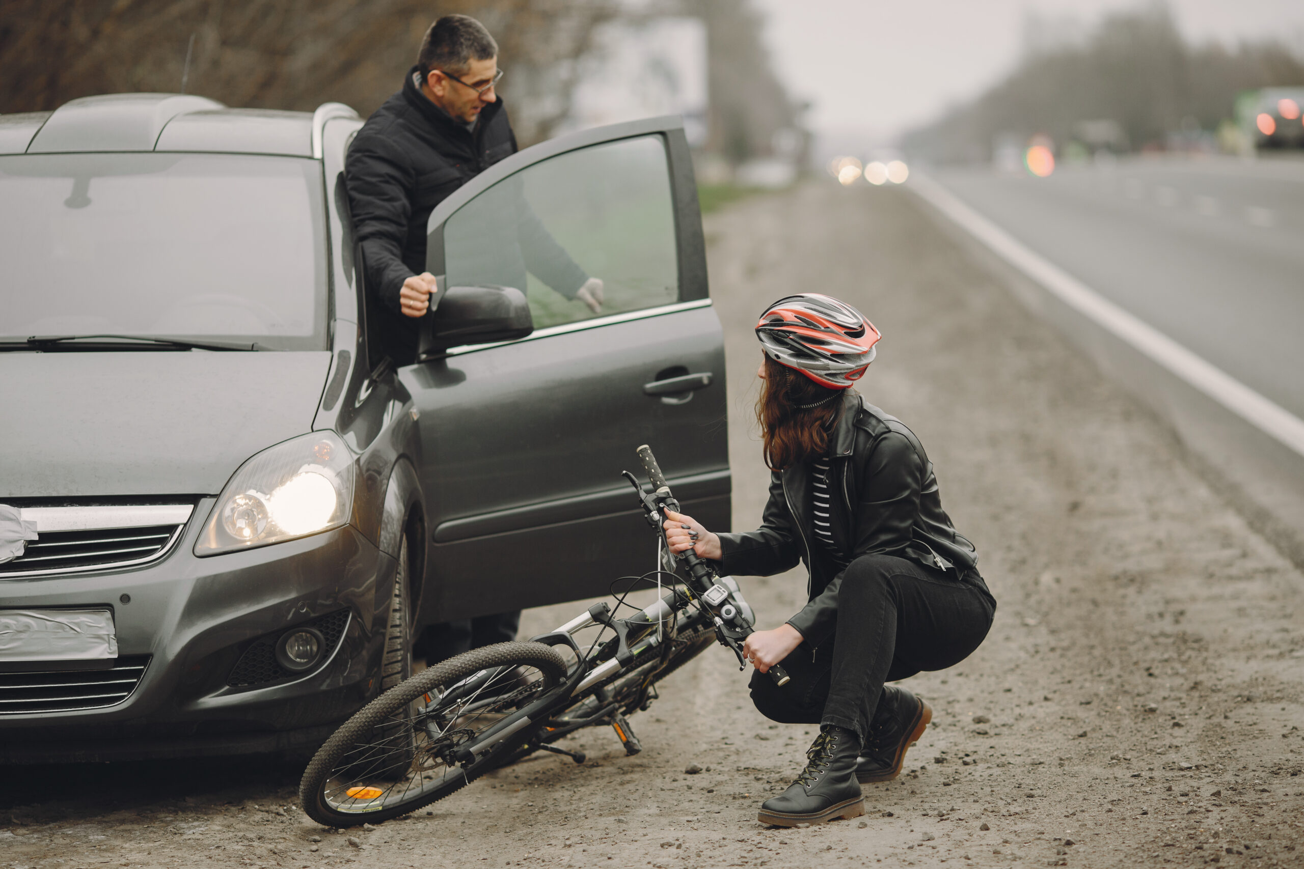 Road accident with cyclist man driver and car